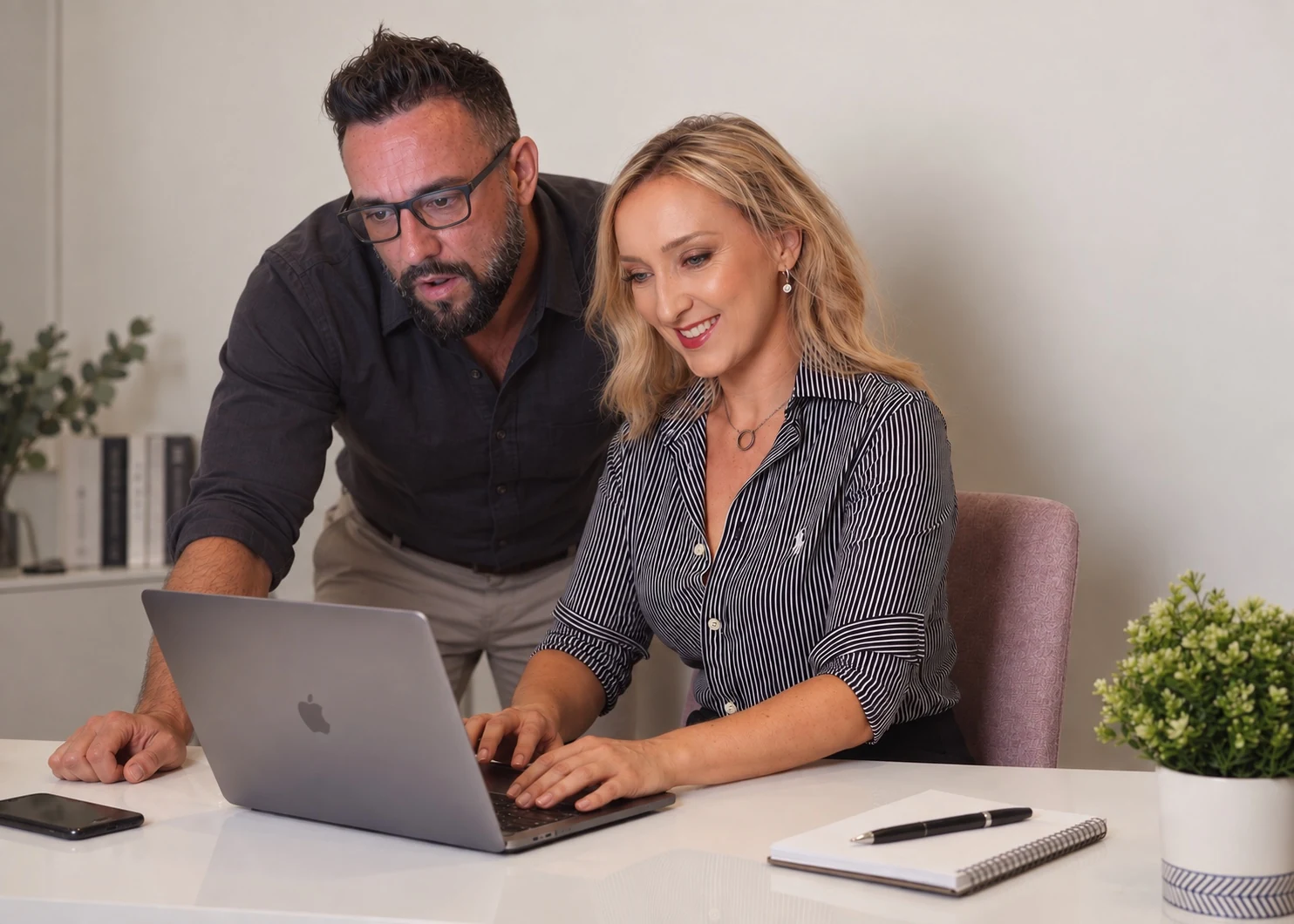 Kristi Hall and Nikolai Babkoff collaborating at Cre8ive Digital Solutions